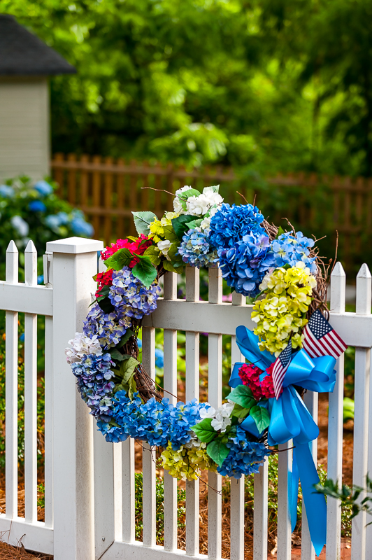 Summer wreath on a picket fence