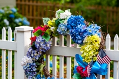 Summer wreath on a picket fence