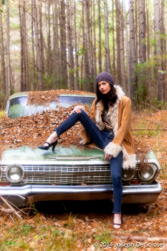 The Impala, Portrait of a young woman sitting on an old Impala.
